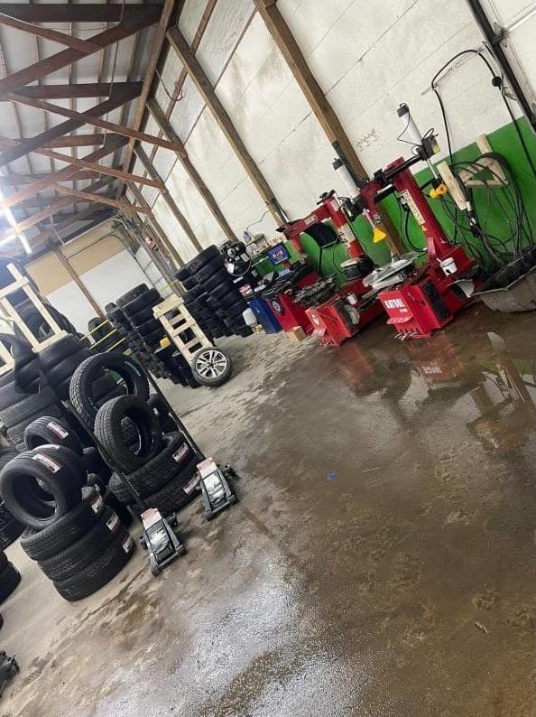 New tires lined up beside the tire machines